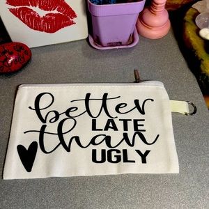 Small white canvas makeup bag with zipper and keychain ring. 💄